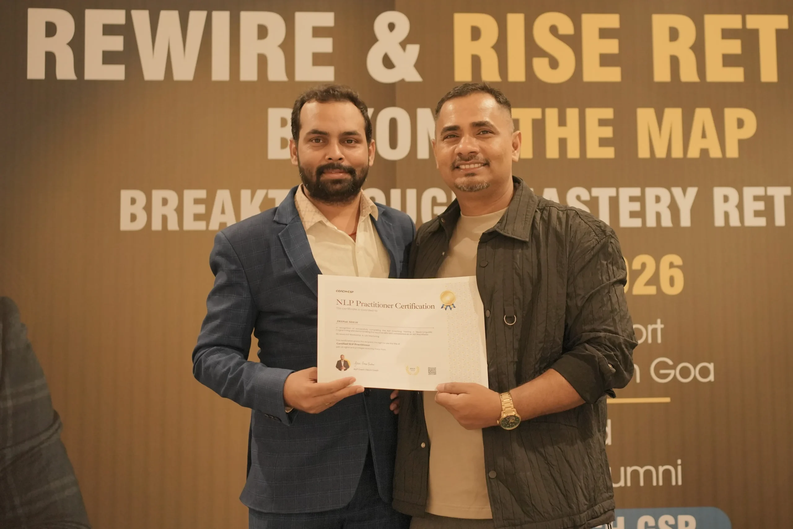 Coach GSP handing the NLP Practitioner certificate to Deepak Singh