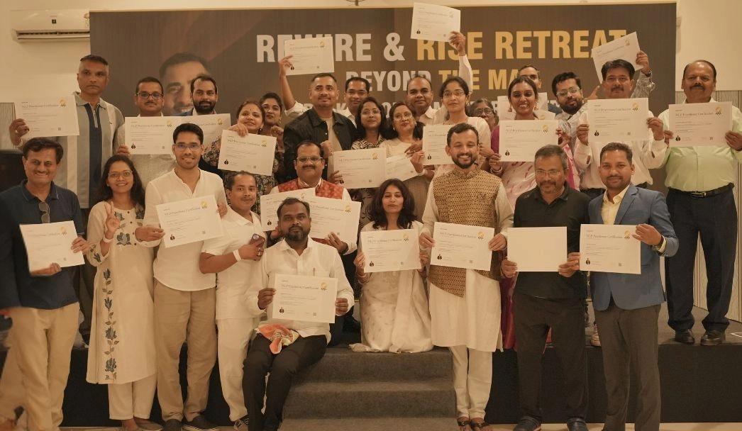 Full batch of NLP Practitioner students holding their certificates at the Rewire & Rise Retreat